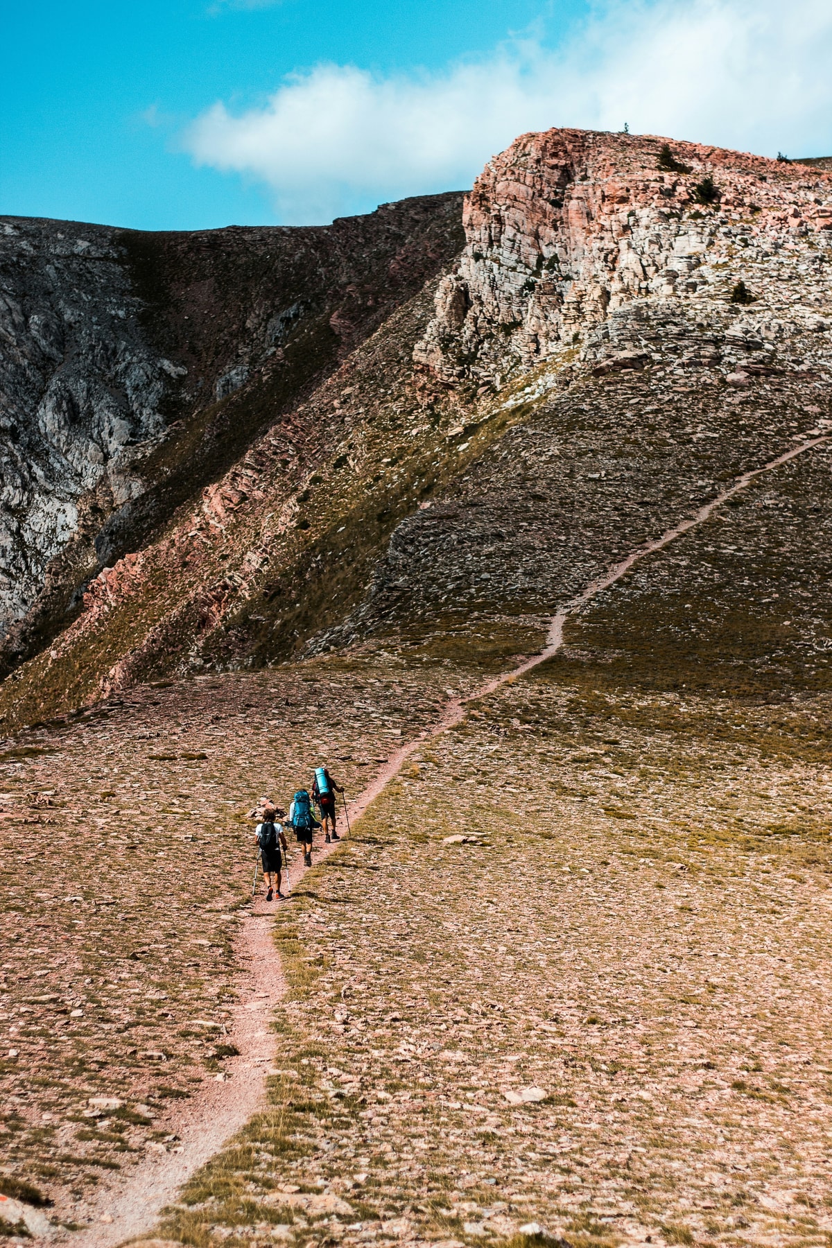 Hikers climbing a trail towards a ridge in the Cadí-Moixeró natural park